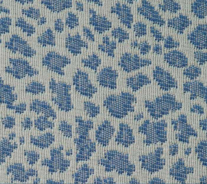 Photo of blue and white animal print fabric.