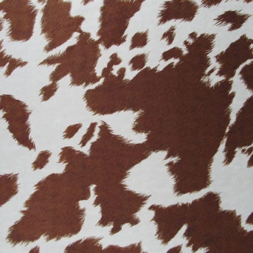 Covington Fabrics Deja Moo Sienna printed suede cow fabric