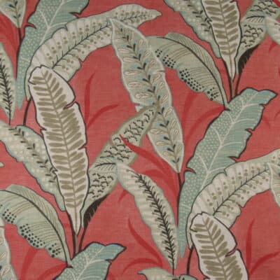 Regal Fabrics Amelia Coral tropical leaf print with aqua green leaves on coral background for upholstery, cushions, pillows.