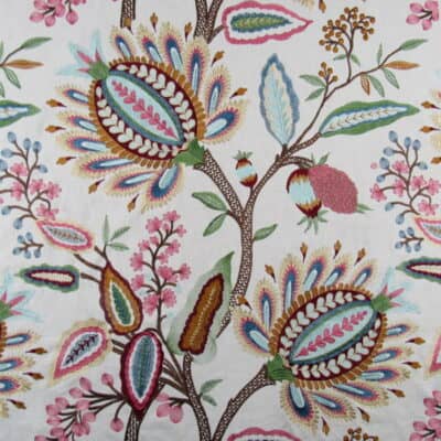 Hamilton Fabrics Cranford Pastel Embroidery with traditional Jacobean floral design in red, coral, aqua, green, gold on natural cotton background.