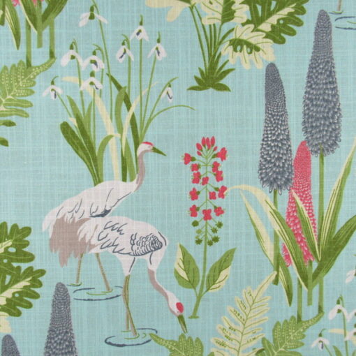 Trevi Fabrics Poise Sky pondscape design with cranes feeding among the green vegetation, printed on polyester linen blend fabric with aqua background.