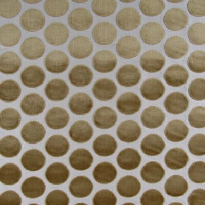 Regal Fabrics Buttons Topaz gold dot cut velvet with beige background. Buttons Topaz is a high quality velvet for upholstery, pillows, cushions.