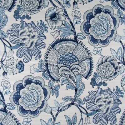 Richloom Fabrics Sheridan Lapis features a navy and blue floral design on a white background, printed on 100% cotton, ideal for furniture upholstery, drapery, bedding, cushions, and pillows.