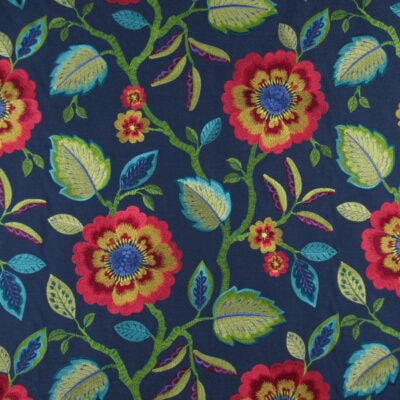 Covington Embroidery Folk Song 557 Dark Denim with traditional floral design in reds, greens and aqua on navy background. Folk Song has exquisite detail and high quality that can be used for upholstery or drapery, bedding, pillows and cushions.