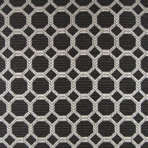 Regal Fabrics Dax Black features a hexagon pattern, woven with 100% polyester for a durable upholstery fabric. It showcases a black background with beige accents, making it ideal for furniture upholstery, pillows, and cushions.