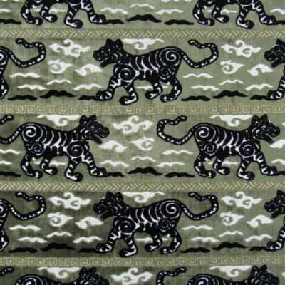 Regal Fabrics Tigress Laurel showcases a bold tiger stripe pattern in green and black. This high-quality velvet is perfect for furniture upholstery, pillows, and cushions.