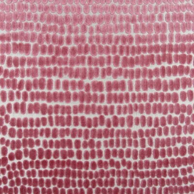 Trevi Fabrics River Stones Peony Velvet features a contemporary dot design in pink. This high-end cut velvet is perfect for furniture upholstery, cushions, and pillows.