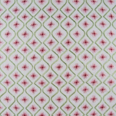 Covington Embroidery Blossom 73 Petal features a clover icon design in pink and green on an off-white background. Its exquisite detail and high quality make it perfect for upholstery, drapery, bedding, pillows, and cushions.