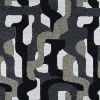 Lilo Pepper features an abstract contemporary design in black and gray, with a soft yet durable heavy chenille texture ideal for upholstery, pillows, or cushions.